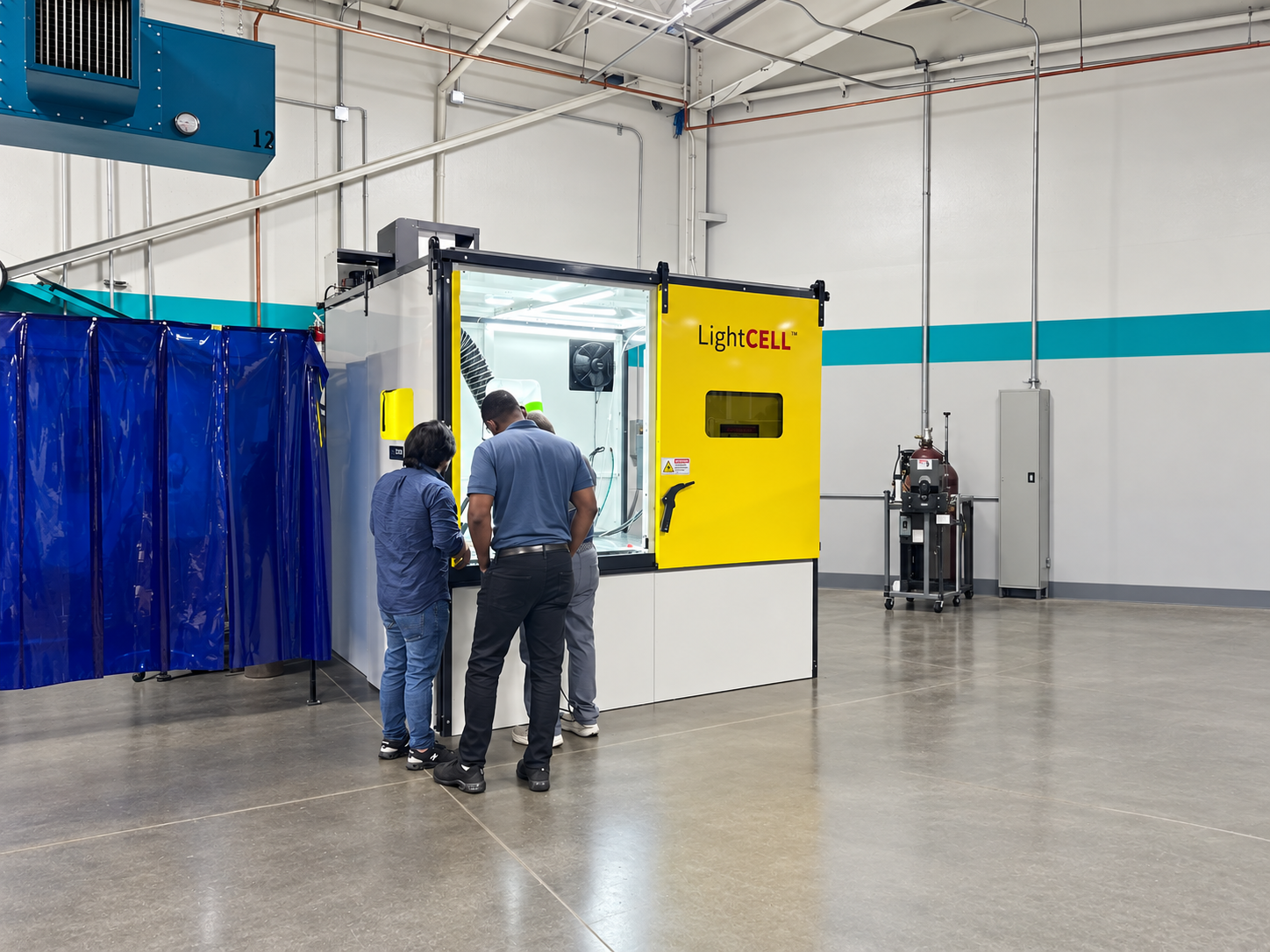 LightCELL enclosure with open loading access and a yellow sliding door