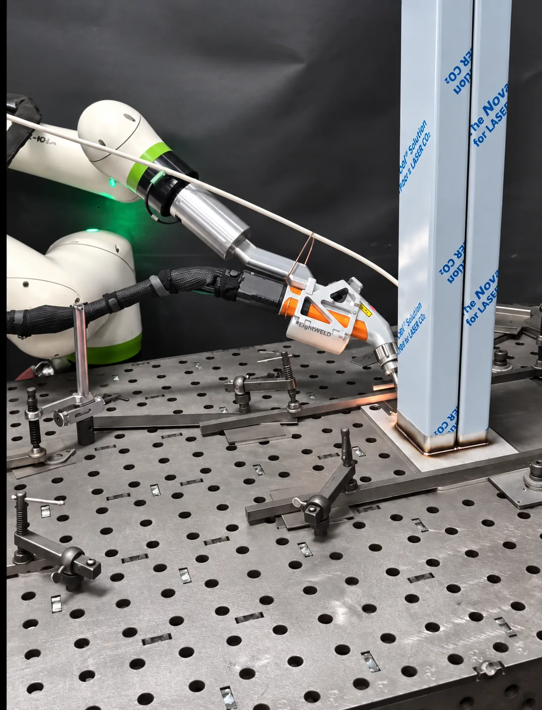 LightBOT welding a stainless steel tube to a base plate