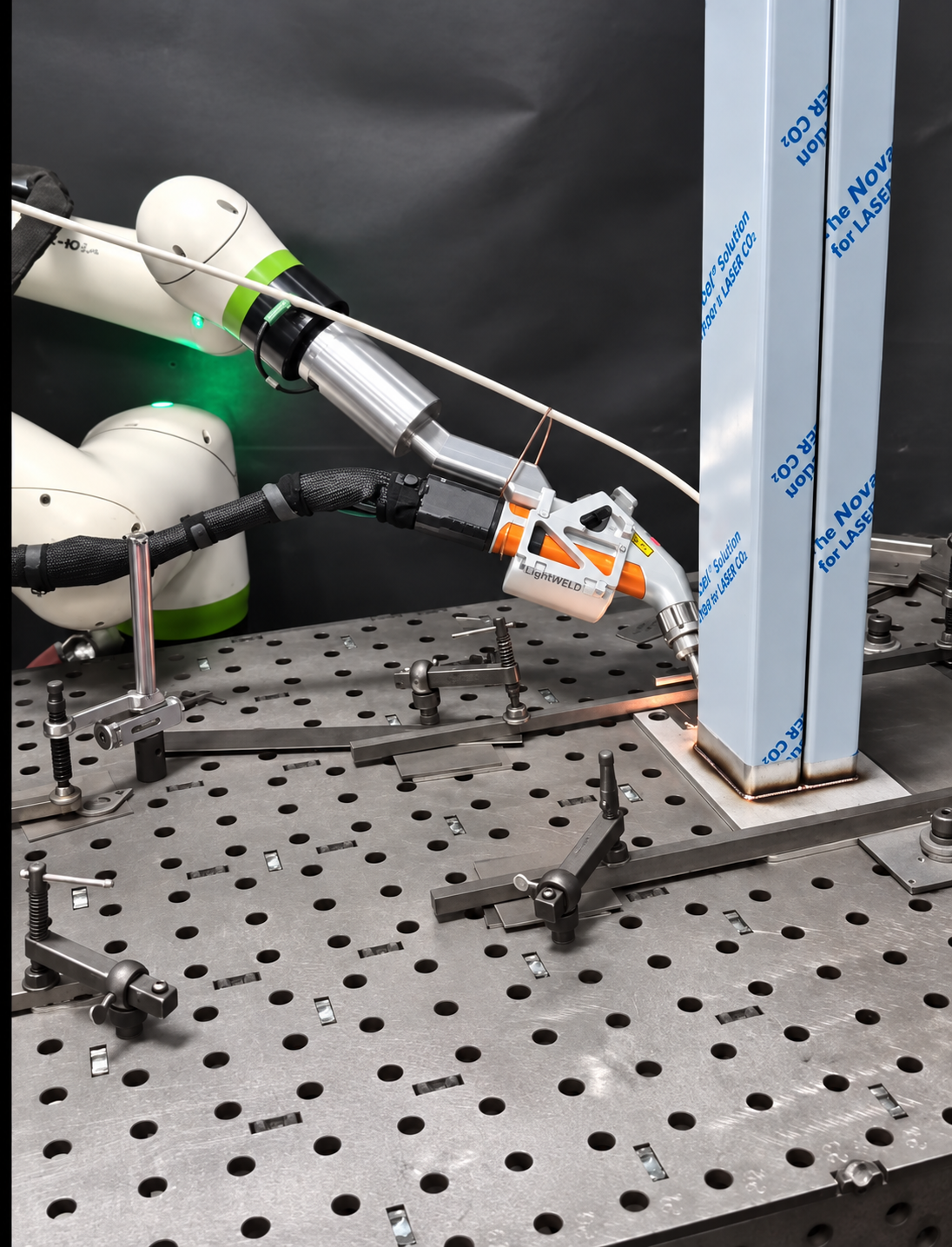 LightBOT welding a stainless steel tube to a base plate